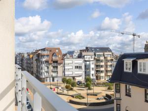 a view of a city from a balcony at Con Amore - 0403 in Westende Bad