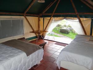 Postel nebo postele na pokoji v ubytování Glamping El Establo