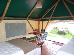 Postel nebo postele na pokoji v ubytování Glamping El Establo