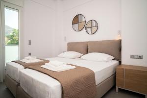 Postel nebo postele na pokoji v ubytování Naiada Apartments