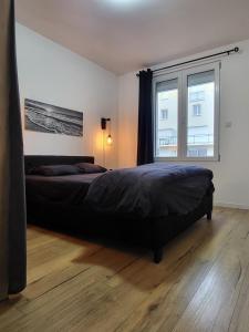 Ένα ή περισσότερα κρεβάτια σε δωμάτιο στο Lueurs des marées