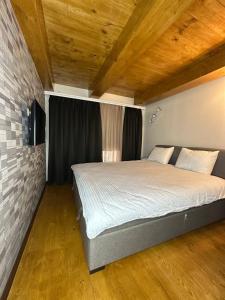 Ένα ή περισσότερα κρεβάτια σε δωμάτιο στο Siena Hotel