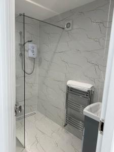 a bathroom with a shower and a sink at The riverside place in Newry +17 photos