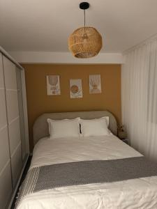 Postel nebo postele na pokoji v ubytování Andrra Apartment