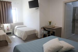 Ένα ή περισσότερα κρεβάτια σε δωμάτιο στο Agriturismo Green Planet