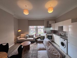 a living room with a couch and a table at The Bluebird B&B III in Central Station