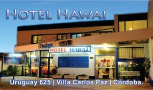 a hotel hawaiian sign on the side of a building at Hotel Hawai in Villa Carlos Paz