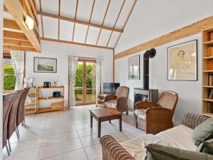 a living room with a couch and a table at Zeepark Haerendycke - Vakantiewoning 40 in De Haan