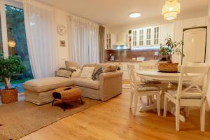 a living room with a couch and a table at Anur Apartment II in Ptuj