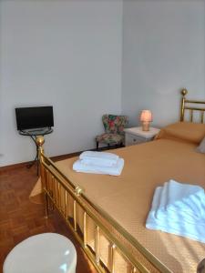 Ένα ή περισσότερα κρεβάτια σε δωμάτιο στο House Tramonto D'oro