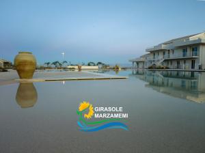 Photo de la galerie de l'établissement Marzamemi - Appartamento Girasole al Resort Borgo 84, à Marzamemi 27 autres photos