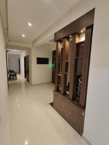a hallway in a building with a room at Suites19 in Bengaluru