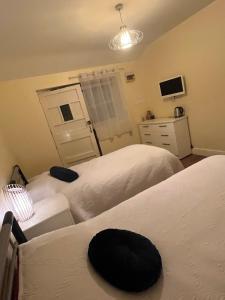 Postel nebo postele na pokoji v ubytování Queens Head