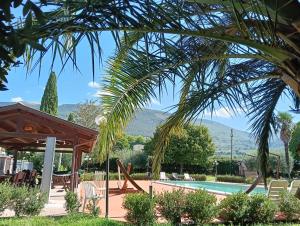 a resort with a pool and a pavilion at Hotel Valle del Subasio in Capitan Loreto