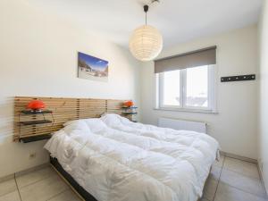 Ένα ή περισσότερα κρεβάτια σε δωμάτιο στο Dunepanne - 0502