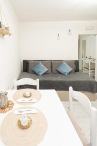 a living room with a couch and a table at Casa Gioia in Chioggia +11 photos