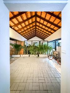 a large building with a large room with plants at Pridi cozy home with good location Type A in Bangkok