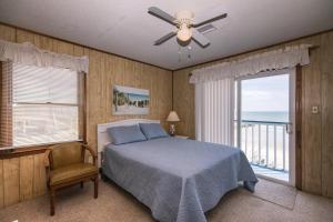 Ένα ή περισσότερα κρεβάτια σε δωμάτιο στο Sea Breeze