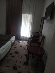 Μια τηλεόραση ή/και κέντρο ψυχαγωγίας στο Hotel white balcony