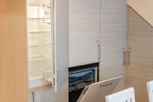 Kuchyň nebo kuchyňský kout v ubytování Vila Liepa + 42 fotografií