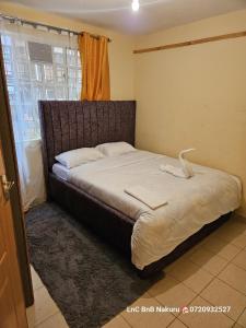 Ένα ή περισσότερα κρεβάτια σε δωμάτιο στο LnC bnb