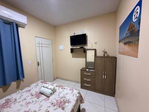 Ένα ή περισσότερα κρεβάτια σε δωμάτιο στο Caribe de Alter - Hotel & Pousada