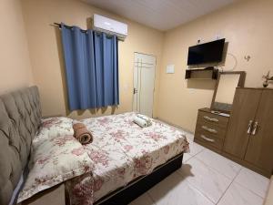 Ένα ή περισσότερα κρεβάτια σε δωμάτιο στο Caribe de Alter - Hotel & Pousada