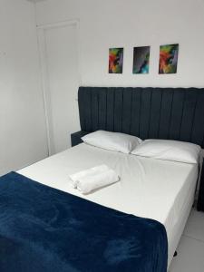 Una cama o camas en una habitación de Pousada Oásis Tamandaré