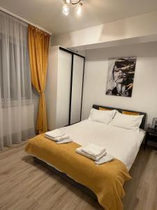 Postel nebo postele na pokoji v ubytování Yellow Apartment