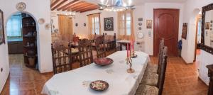a dining room with a white table and chairs at Kolymbia home in Kolymbia