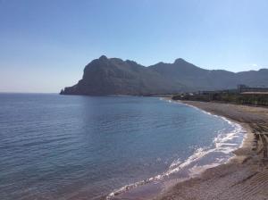 a view of a beach with a mountain in the background at Kolymbia home in Kolymbia