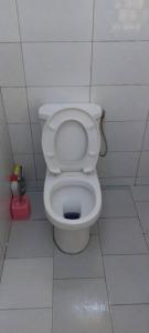 a bathroom with a white toilet in a stall at FassoImmoPrestige in Tambacounda +34 photos