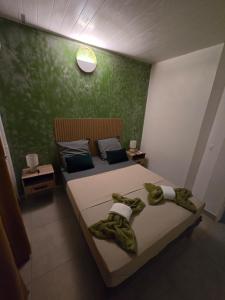 Ένα ή περισσότερα κρεβάτια σε δωμάτιο στο Bas de villa Meilya