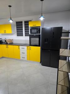 Η κουζίνα ή μικρή κουζίνα στο Bas de villa Meilya