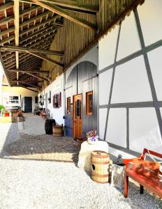 a large building with a room with a wooden door at Zum Scheunenhof - Scheune in Ichenhausen