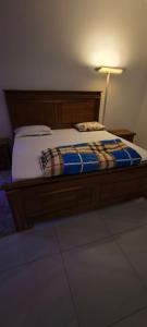 Postel nebo postele na pokoji v ubytování FassoImmoPrestige