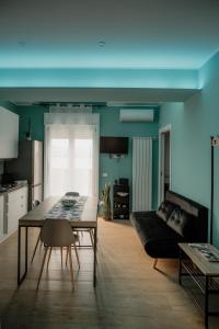 a living room with a table and a couch at Sarina's apartment in Palermo +21 photos