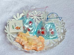 a plate of food with food in plastic bags at Henn na Hotel Tokyo Nishikasai in Tokyo