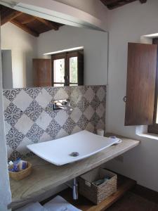 a bathroom with a sink and a mirror at L'Infinito in Mombaroccio +51 photos