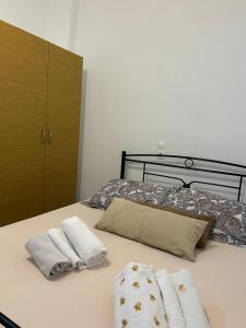 Postel nebo postele na pokoji v ubytování Lemonia