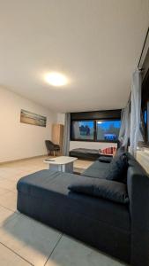 Posezení v ubytování Alex Garden Apartments - EG - Terrasse - WLAN und Küche