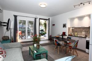 a living room with a couch and a table at Harmonia in Athens
