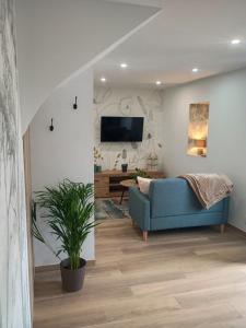 Televiisor ja/või meelelahutuskeskus majutusasutuses Gîte charmant typique Breton Ti Quartier