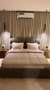 En eller flere senge i et værelse på Deluxe Studio Self Check In