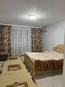 Giường trong phòng chung tại гостиница Азия