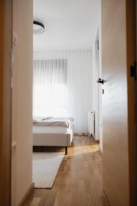 Ένα ή περισσότερα κρεβάτια σε δωμάτιο στο Una Lux Apartment