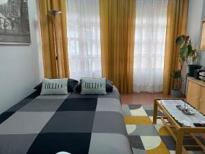 a bedroom with a large bed and a table at La casita de Lukas in Sabero