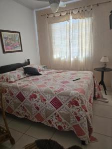 Giường trong phòng chung tại Casa Praia Linda