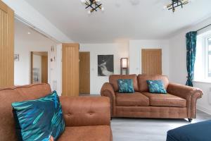 Et opholdsområde på Holiday Home with Hot Tub