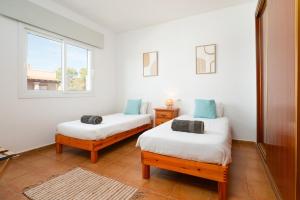 En eller flere senge i et værelse på Villa Sofia